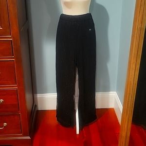 Women's size Large black sequin pants. Elastic waist band. NEVER WORN